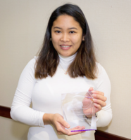 Joanna Carmona holding the crystal keepsake